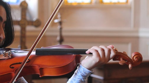 A women playing a violin at Lyme, Cheshire